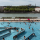 People visit a swimming pool in the center of Lyon, central France, on June 25.